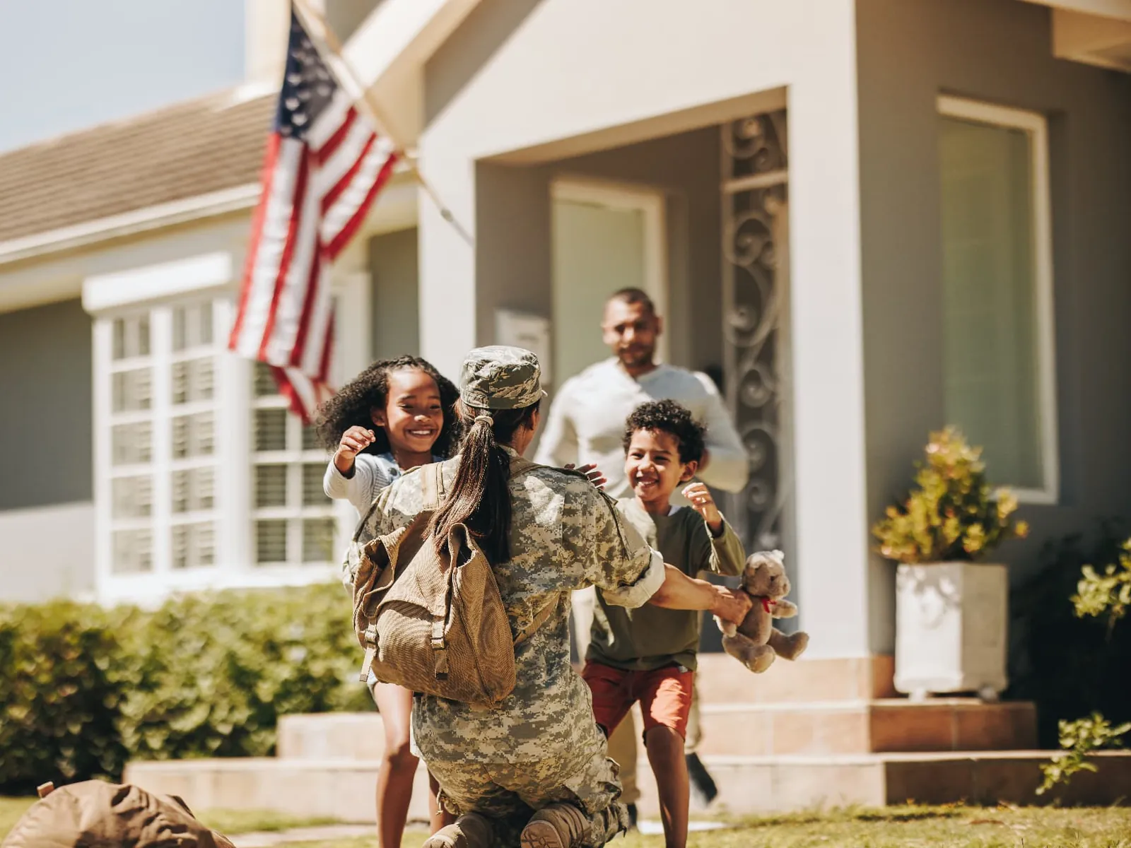 Service member home to her family, kids running to hug her